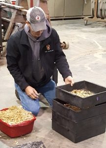Harvested forage material was added to the top box of the particle separator boxes.  The boxes are shaken horizontally according to a protocol, then material from each layer is weighed individually to determine fraction percentages.  