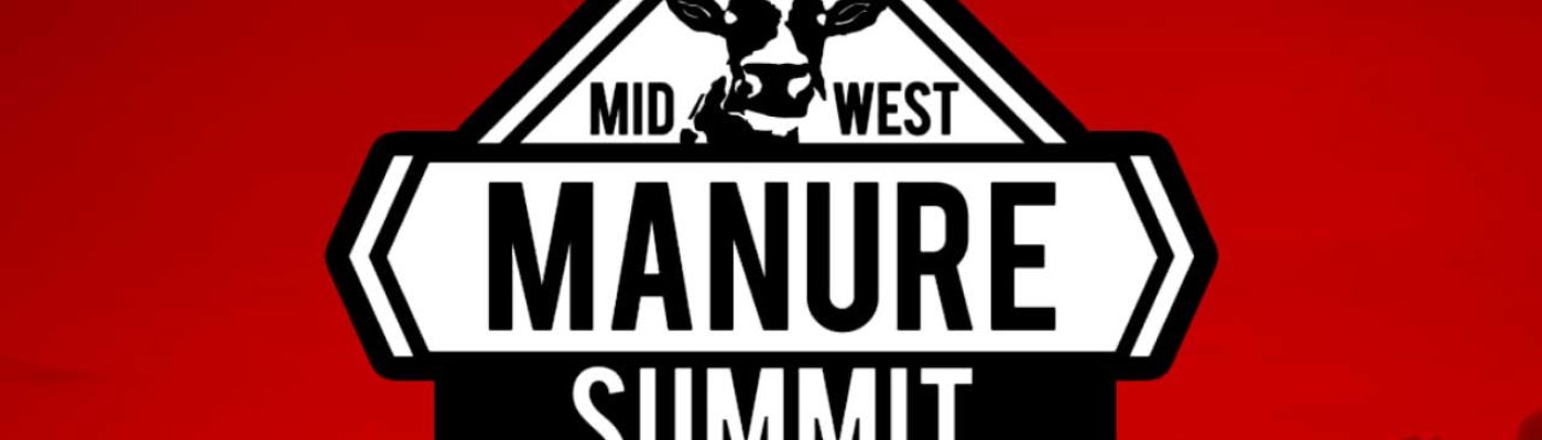 The image shows a road sign for the "Mid-West Manure Summit", with a silhouette of a cow or bovine animal at the top of the sign. The sign has a red background with the black text and symbol standing out prominently.