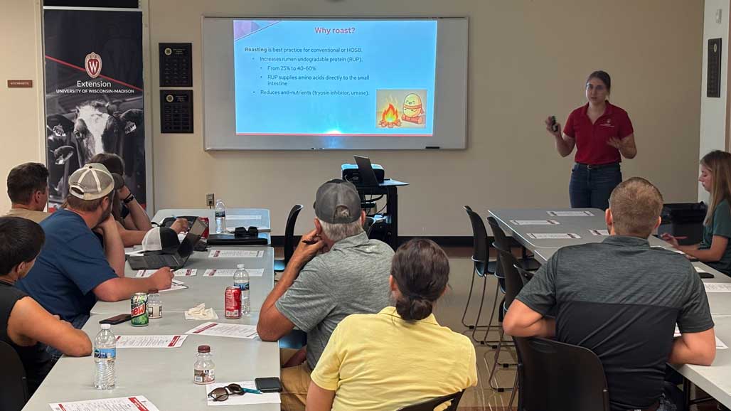 Extension educator presents on roasting soybeans to seated attendees at a UW–Madison Extension training session.