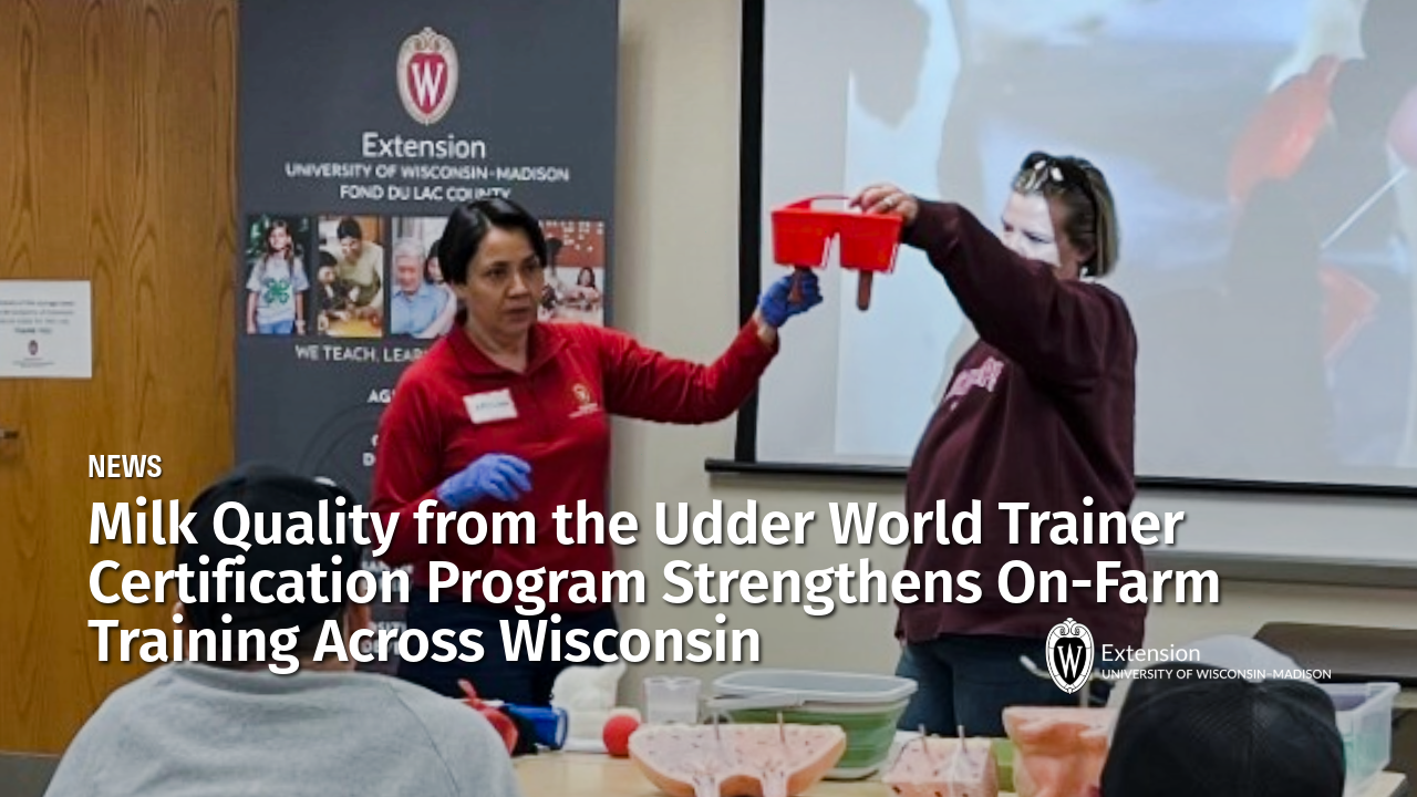 News: Milk Quality from the Udder World Trainer Certification Program Strengthens On-Farm Training Across Wisconsin. Two women demonstrating udder handling for dairy cows.